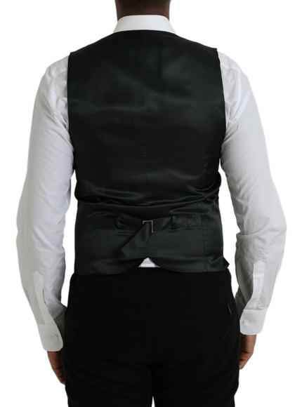 a man wearing a black vest and white shirt