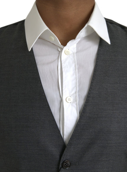 a close up of a person wearing a suit and tie