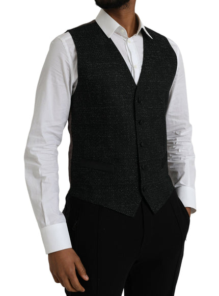 a man wearing a black vest and white shirt