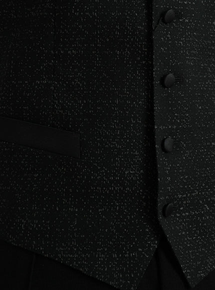 a close up of a black suit with buttons