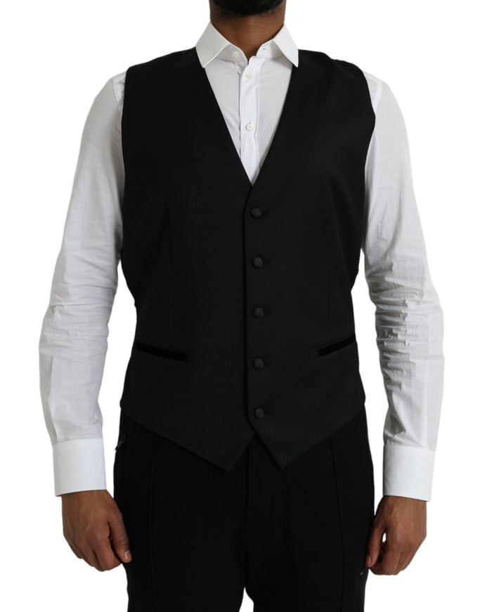 a man wearing a black vest and white shirt