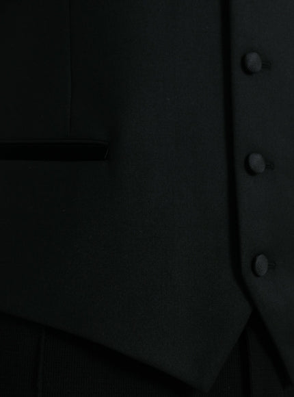 a close up of a black suit with buttons