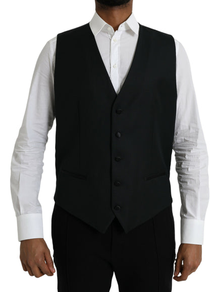 a man wearing a black vest and white shirt