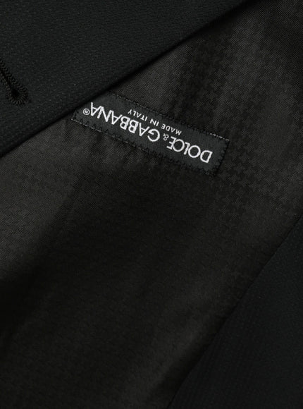 a black jacket with a white label on it