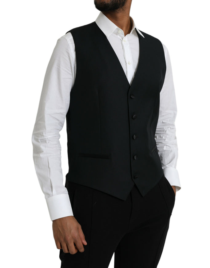 a man wearing a black vest and white shirt