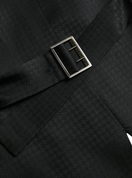 a close up of a black suit with a metal buckle