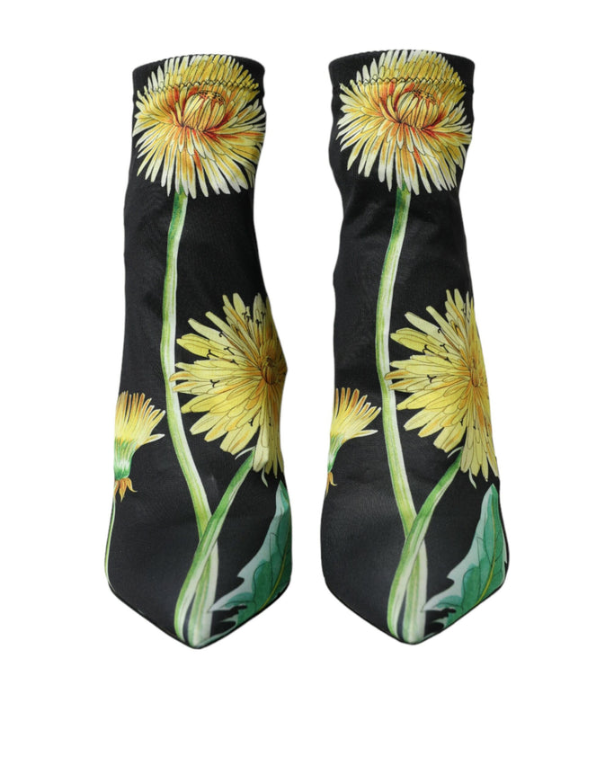 a pair of yellow flowers on a black background