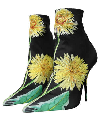 a pair of black high heels with yellow flowers on them