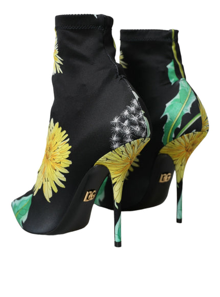 a pair of black high heels with yellow flowers on them