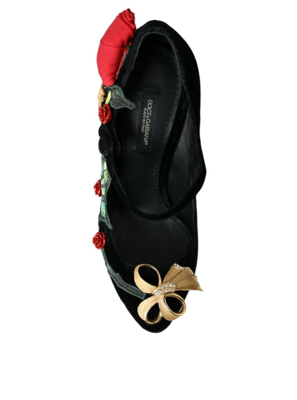 a pair of black shoes with flowers on them