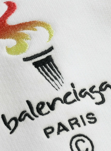 a close up of a logo on a white shirt