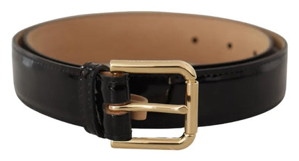 a black leather belt with a gold buckle