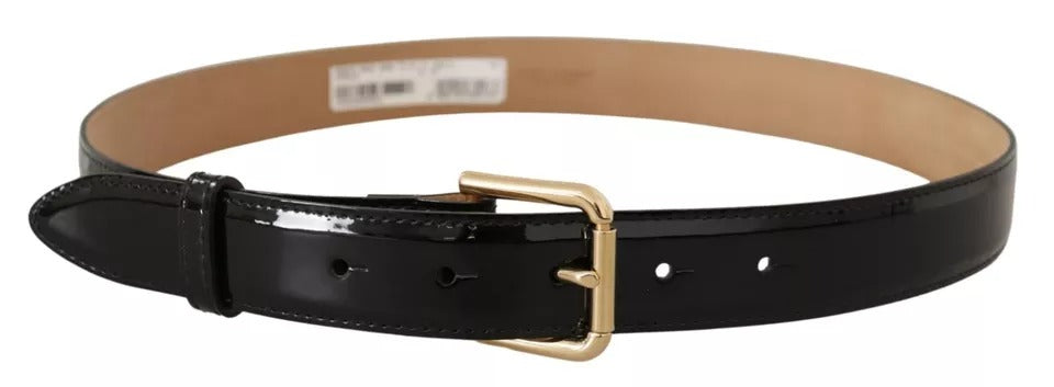 a black leather belt with a gold buckle