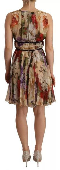 a woman wearing a dress with flowers on it