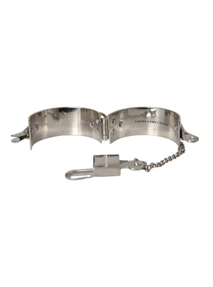 a metal bracelet with a chain attached to it