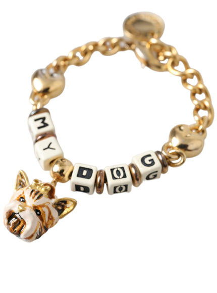 a gold bracelet with a dog charm on it