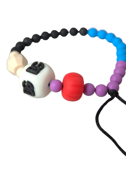 a pacifier with a colorful bead and a black cord