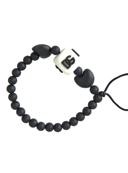 a black and white beaded bracelet on a white background