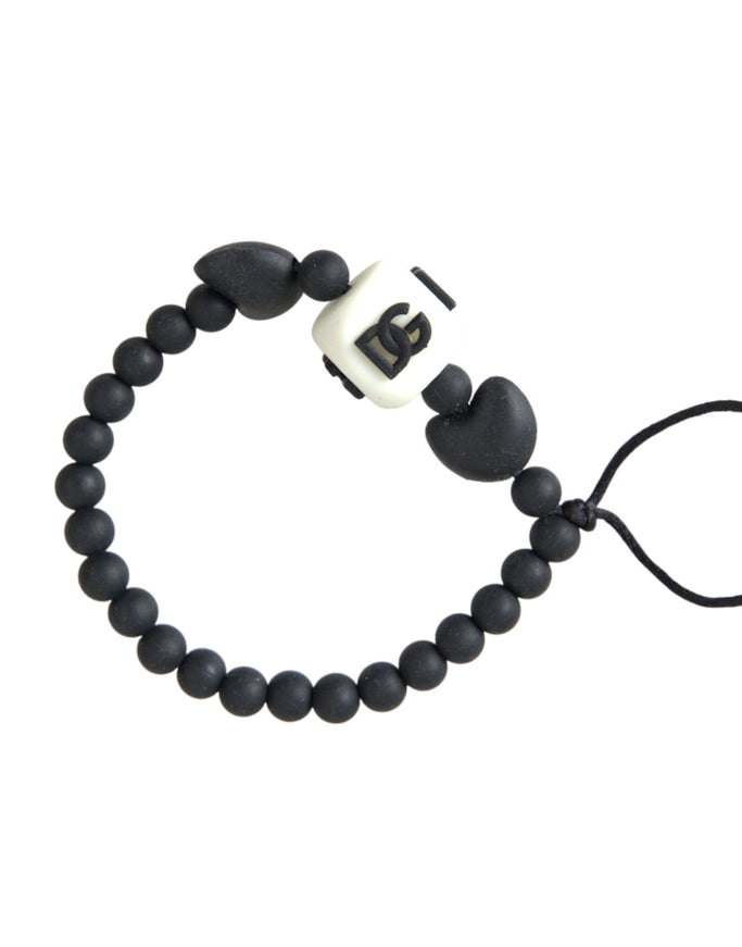 a black and white beaded bracelet on a white background