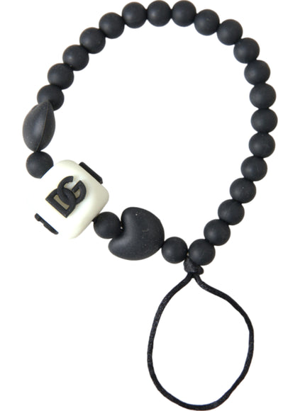 a black and white beaded bracelet with a black cord