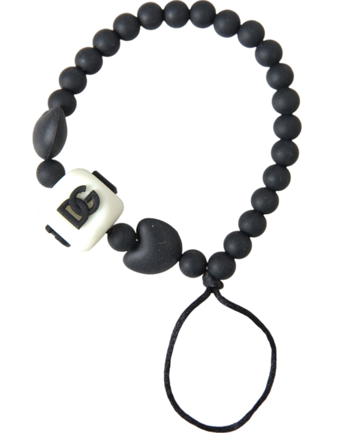 a black and white beaded bracelet with a black cord