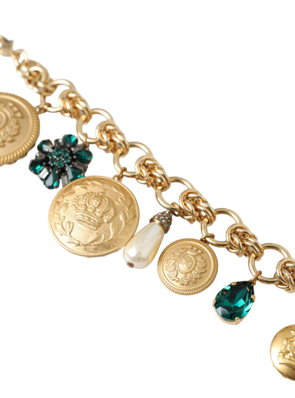 a close up of a gold bracelet with charms