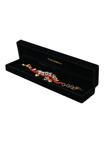 a black box with a red and gold bracelet in it