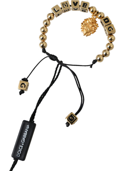 a gold beaded bracelet with a lion head