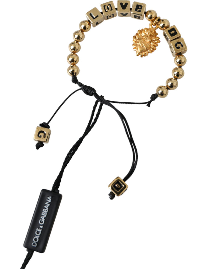 a gold beaded bracelet with a lion head