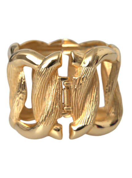 a gold ring with a twisted design on it