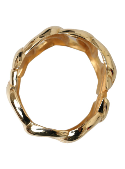 a gold ring on a white background