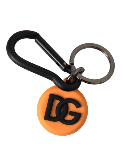 an orange and black keychain with the letter g on it