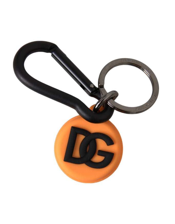 an orange and black keychain with the letter g on it