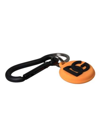 a black and orange keychain with the letter b on it