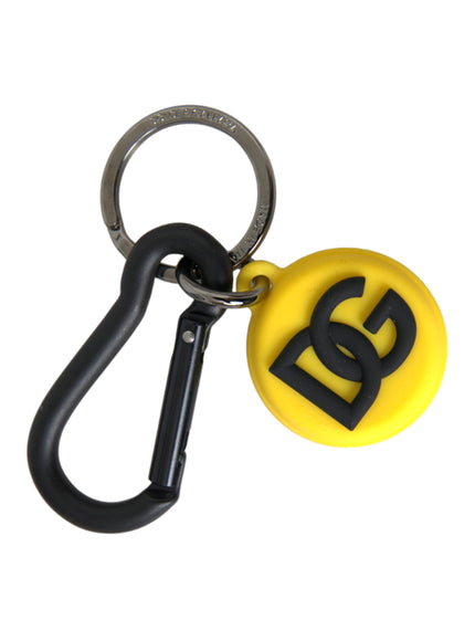 a yellow and black keychain with a logo on it