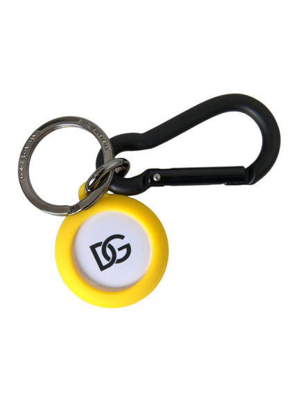 a yellow and white keychain with a black handle