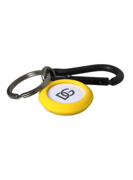 a yellow and white keychain with a black handle