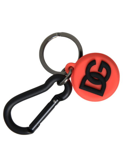 a red and black keychain with the letter s on it