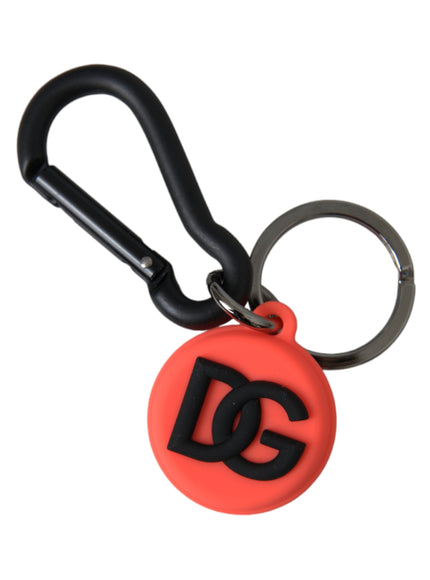 a red and black keychain with a logo on it