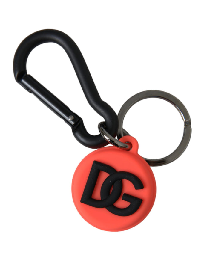 a red and black keychain with a logo on it