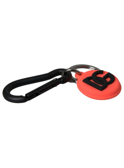 a red and black keychain with the letter b on it