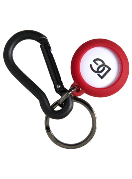 a red and white keychain with a black handle