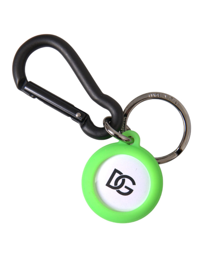 a green and white keychain with a black handle