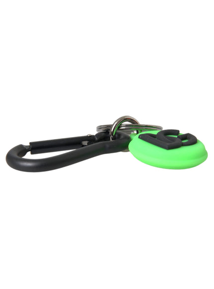 a pair of black and green scissors on a white background