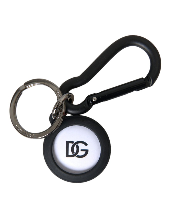 a black and white keychain with a logo on it