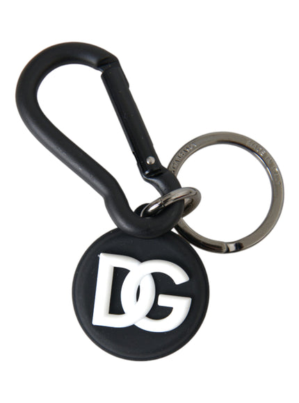 a black and white keychain with a logo on it