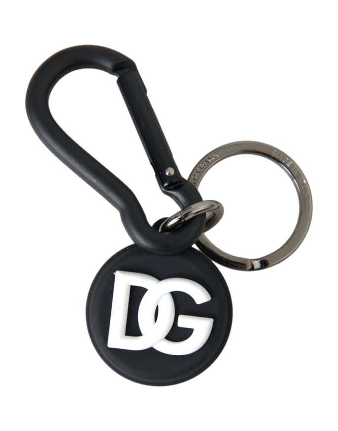 a black and white keychain with a logo on it