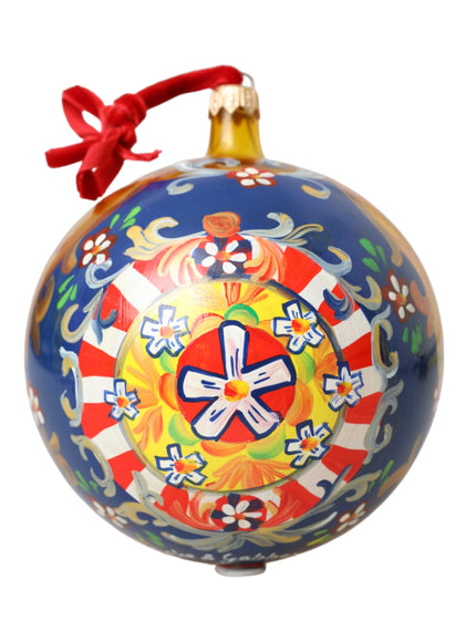 a blue ornament with a red ribbon around it