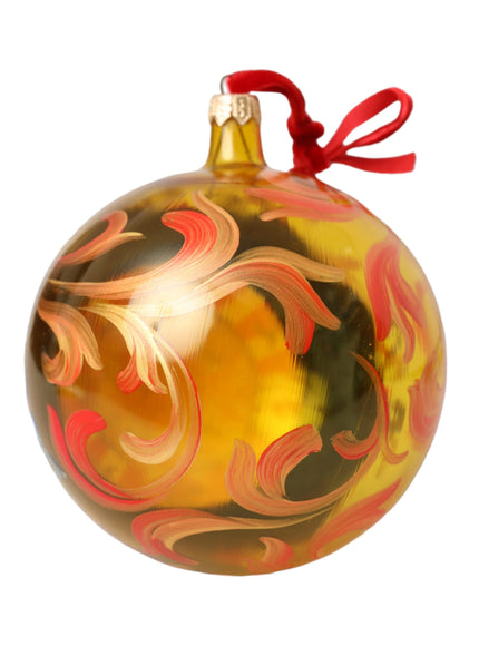 a glass ornament with a red ribbon on a white background