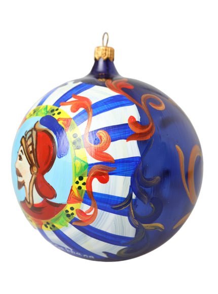 a blue ornament with a picture of a woman on it